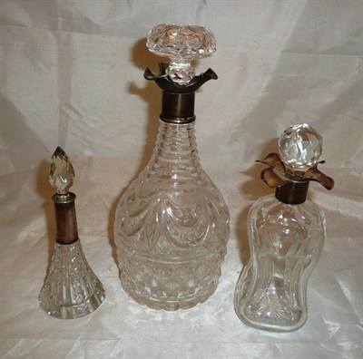Lot 41 - A cut glass mallet decanter and stopper with silver mount, a silver mounted liqueur decanter...
