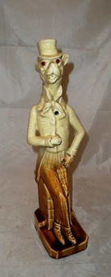 Lot 42 - A novelty posy holder in the form of a gentleman with a dog's head