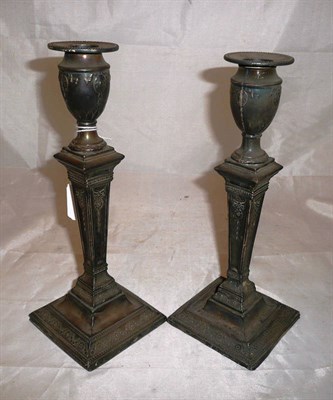 Lot 43 - A pair of Adams style silver candlesticks