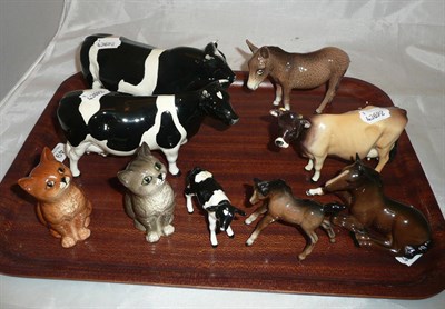 Lot 49 - Nine Beswick figures: Friesian bull, cow and calf, Guernsey cow, two foals, a donkey and two cats