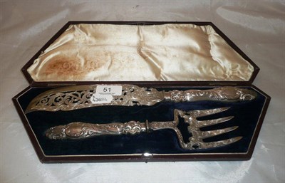 Lot 51 - A cased pair of Victorian silver fish servers