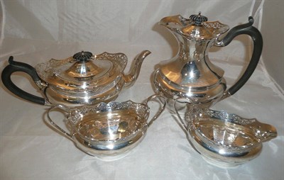 Lot 56 - A George VI silver four piece tea service with foliate pierced rims, Birmingham W, 45.4oz
