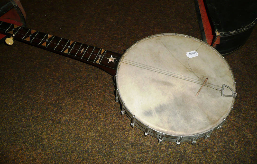 Lot 62 - A five string banjo in leather case