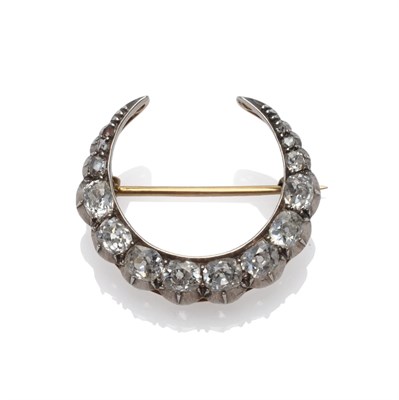 Lot 202 - A Victorian Diamond Crescent Brooch, set with graduated old cut diamonds in white collet...
