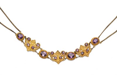 Lot 203 - An Amethyst Set Collar Necklace, set with oval cut amethysts in bead frames, alternating with...