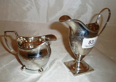 Lot 83 - A George III silver helmet shape cream jug, London 1814 (mark overstruck); a George III silver...