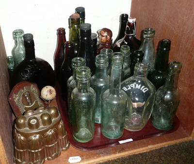 Lot 97 - A copper jelly mould, a golfing trophy, collection of vintage and other bottles etc