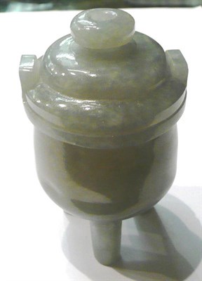 Lot 118 - A small jade type vase on three legs