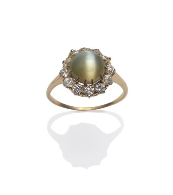 Lot 208 - A Cat's-Eye Chrysoberyl and Diamond Cluster Ring, the round cabochon cat's-eye stone within a...