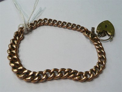 Lot 134 - A 9ct curb and lock bracelet, 24.4g
