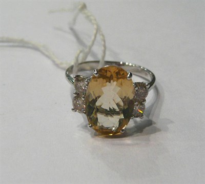 Lot 135 - A 14ct white gold yellow beryl and diamond ring