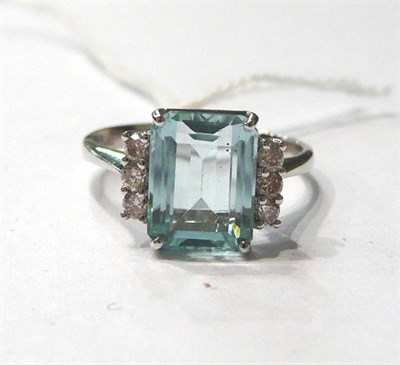 Lot 147 - A 14ct white gold aquamarine and diamond ring