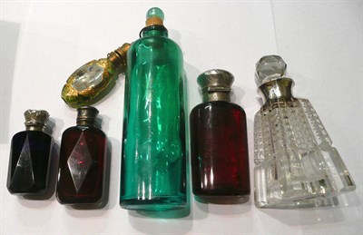 Lot 150 - Four glass scent bottles with silver mounts and two others