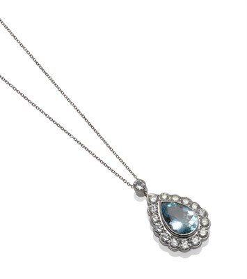 Lot 214 - An Aquamarine and Diamond Necklace, a pear cut aquamarine within a border of round brilliant...
