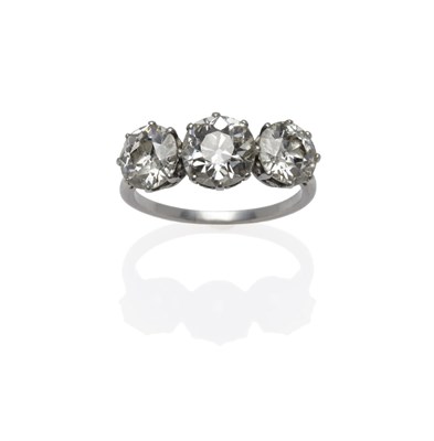 Lot 219 - A Diamond Three Stone Ring, circa 1910, the graduated old cut diamonds in white claw settings, to a