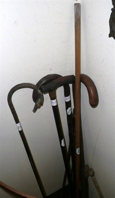 Lot 254 - A collection of various walking sticks, whips etc
