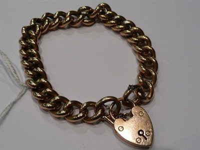Lot 261 - A 9ct gold curb and lock bracelet, 22g
