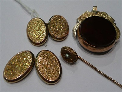 Lot 264 - A seed pearl tie pin, a pair of cufflinks and a swivel fob