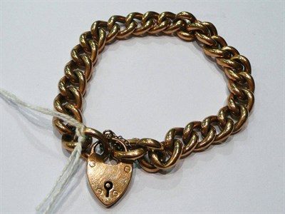 Lot 275 - A 9ct gold curb link bracelet with padlock fastener, 18gm