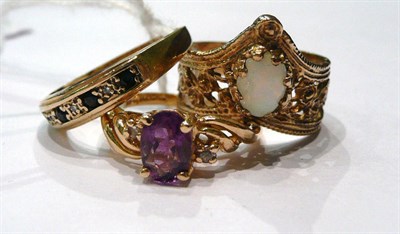 Lot 278 - A 9ct gold opal ring, a 9ct gold sapphire an diamond ring and an amethyst ring stamped '14k'