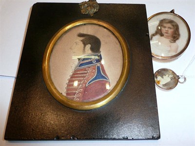 Lot 282 - Oval miniature of a young girl; another papier mache framed miniature and a photograph locket