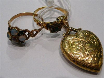 Lot 292 - Two stone set gold rings and a gold heart-shaped locket