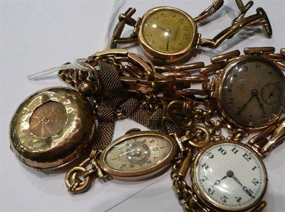 Lot 303 - Four ladies wrist watches, cases stamped '375', chain stamped 9ct and a sovereign holder...