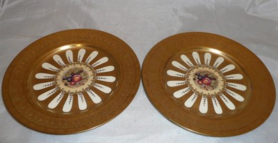 Lot 323 - A pair of Aynsley fruit decorated cabinet plates with richly gilt borders