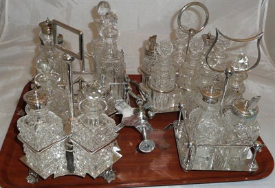 Lot 330 - Four assorted glass condiments in plated stands