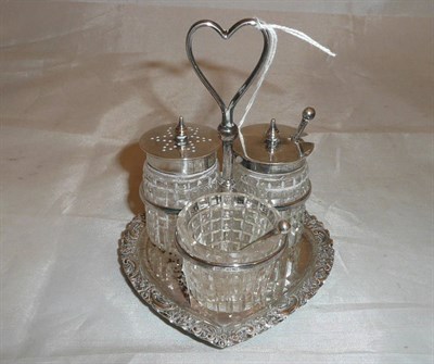 Lot 353 - Silver heart shaped three piece cruet