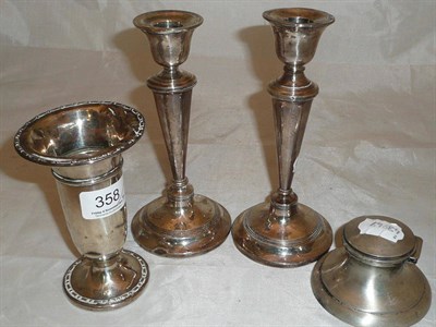 Lot 358 - A pair of silver loaded candlesticks, silver loaded ink well and a silver loaded vase