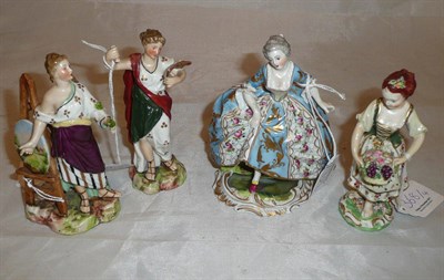 Lot 368 - Derby figure of a young girl with a basket of fruit (a.f.) and three Continental figures (4)