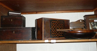 Lot 373 - A shelf of treen including a perpetual calendar, a stationery rack, tea caddies, glove...