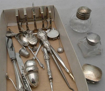 Lot 392 - A collection of silver including toast rack, flatware, pill boxes etc