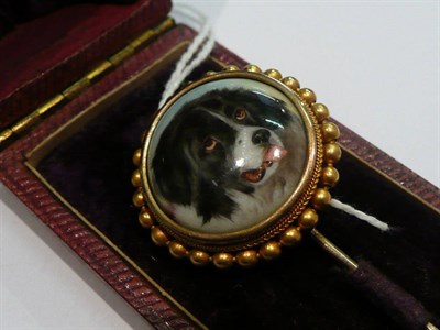 Lot 401 - A gold stick pin set with an enamel panel painted with the head of a Newfoundland dog by W B...