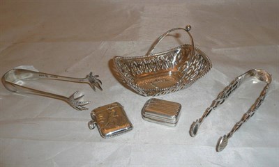 Lot 402 - A pierced silver basket with Chester hallmark, two silver sugar tongs, vesta case stamped '925'...