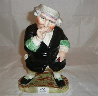 Lot 405 - Staffordshire snuff taking figure