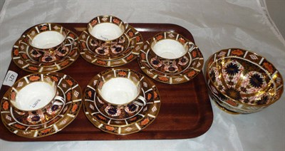 Lot 421 - A set of five Royal Crown Derby Imari cups, saucers and plates, and a matching slop basin