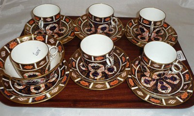 Lot 422 - A set of six Royal Crown Derby Imari pattern cups, saucers and plates and a matching slop basin