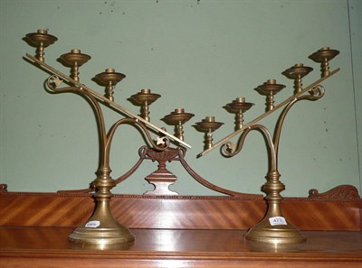 Lot 423 - Pair of brass candlesticks