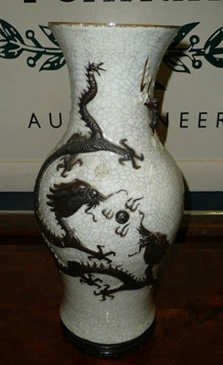 Lot 428 - A Chinese crackle glaze vase decorated in relief with dragons