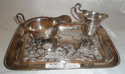 Lot 430 - A rectangular silver tray, sauce boat and a small cream jug 11.69oz