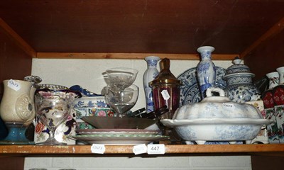 Lot 447 - A shelf of decorative ceramics and glass including a Bohemian glass goblet and cover, a large...