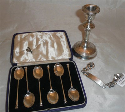 Lot 453 - A small quantity of silver comprising teaspoons, bracelet and a loaded candlestick