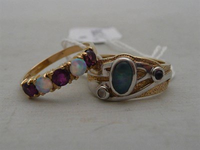 Lot 457 - A 9ct Clogau ring set with an opal triplet, moonstone and garnet and a 9ct gold garnet and opal...