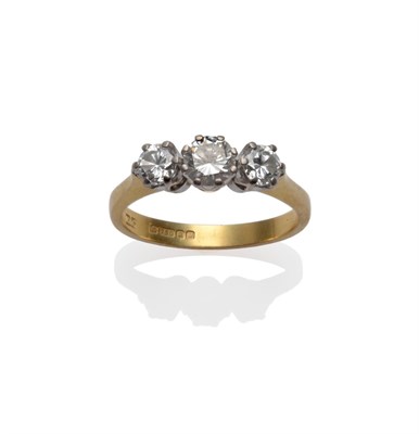 Lot 242 - An 18 Carat Gold Diamond Three Stone Ring, the graduated round brilliant cut diamonds in white claw