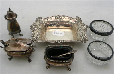 Lot 471 - A silver pin dish, a silver three piece condiment set and a pair of glass salts