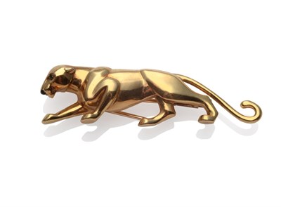 Lot 243 - A Panthère Brooch, by Cartier, modelled as a prowling panther with emerald eyes and a cabochon...