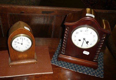 Lot 490 - A mahogany mantel clock by Maple & Co; a small oak lancet cased mantel timepiece (2)