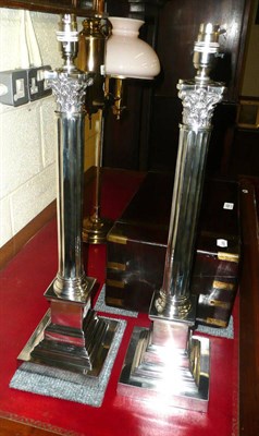 Lot 491 - Pair of modern silver plated Corinthian column table lamps